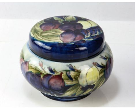 WILLIAM MOORCROFT (British,1972-1945) for MOORCROFT, Wisteria circular squat shouldered trinket/tobacco jar with lid. Impress