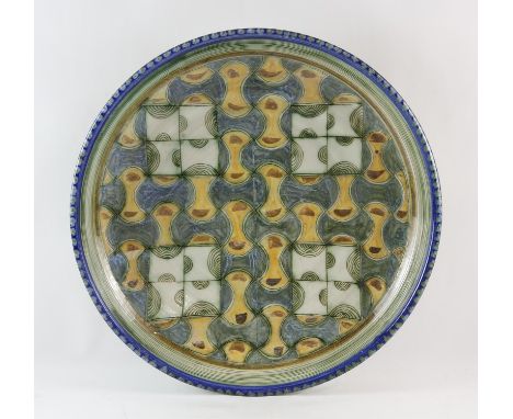 ROELOF UYS, (CONTEMPOARY, SOUTH AFRICAN), a large stoneware charger, decorated with geometric designs, with blue dash decorat