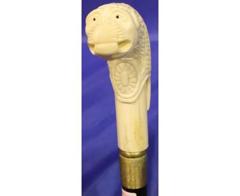 Carved bone handled, animal head walking stick, L: 90 cm. P&amp;P Group 2 (£18+VAT for the first lot and £3+VAT for subsequen