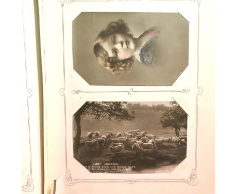 An album of vintage postcards. P&amp;P Group 1 (£14+VAT for the first lot and £1+VAT for subsequent lots) 
