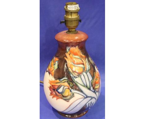 A Moorcroft lamp and shade, H: 20 cm. Crazing throughout, otherwise no cracks, chips or visible restoration. Not available fo