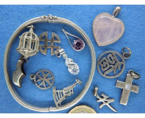 A collection of 925 silver pendants and charms, some stone set, and a heavy gauge silver snap bangle. P&amp;P Group 1 (£14+VA