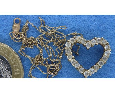9ct gold heart pendant with channel set diamonds on a fine 9ct gold chain. P&amp;P Group 1 (£14+VAT for the first lot and £1+