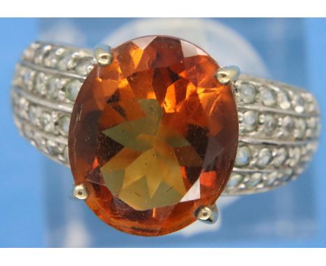 9ct gold citrine ring, set with diamond shoulders, size N/O, 4.0g. P&amp;P Group 1 (£14+VAT for the first lot and £1+VAT for 