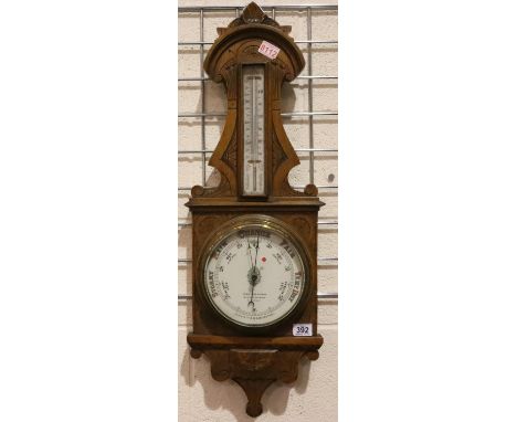 W Watson &amp; Sons, London; an oak cased aneroid barometer with mercury stick thermometer and ceramic face and temperature g