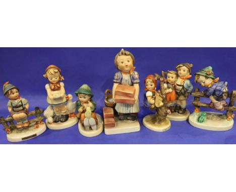 Seven Hummel figurines, each H: 16 cm. Loss of colour to some parts throughout all pieces, no visible chips or cracks overall