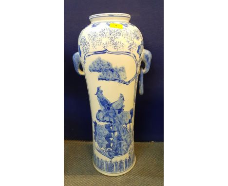 A 20th century blue and white Chinese ceramic stick stand with six Hanzi with images of birds, having twin handles with one m