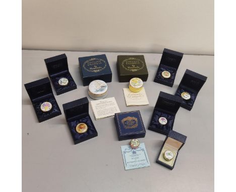 A collection of nine Crummles enamel pill boxes depicting flowers, birds and a limited edition Taeping &amp; Aerial, together