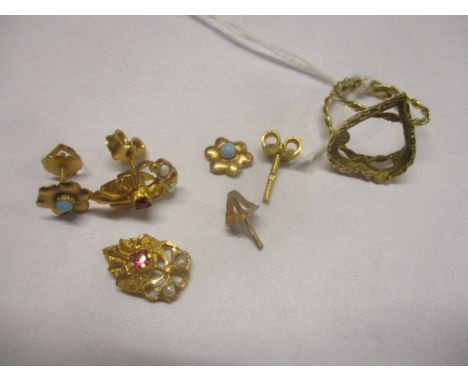 A yellow gold coloured heart shaped wirework ring (stone deficient) and two pairs of Middle Eastern gold coloured ear studs, 