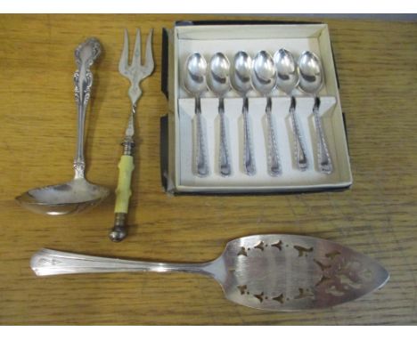 A set of six silver teaspoons, a silver plated toasting fork, commemorative cake slice and a ladleLocation: 