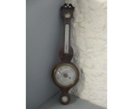 A 19th century mahogany barometer having a broken swan neck pediment and silvered dials, 96"hLocation: 
