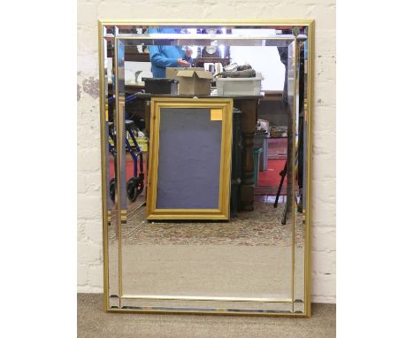 A gilt framed bevel edge wall mirror.