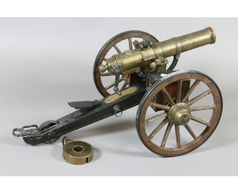 A detailed working scale model of an 1883 gatling gun.