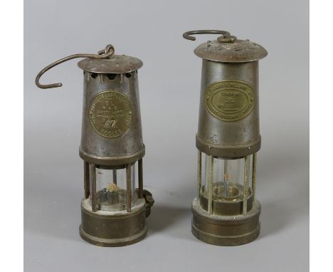 An Eccles coal miners safety lamp along with Cambrian safety lamp by Thomas & Williams.