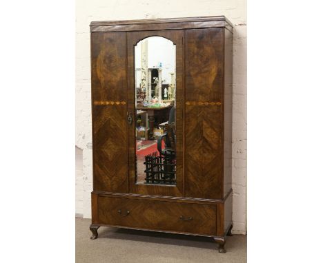 An inlaid walnut mirror front wardrobe with bevel edge glass and base drawer raised on squat cabriole legs.