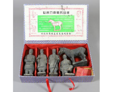 Five Chinese boxed ceramic figures modelled as soldiers and a horse from the terracotta army.
