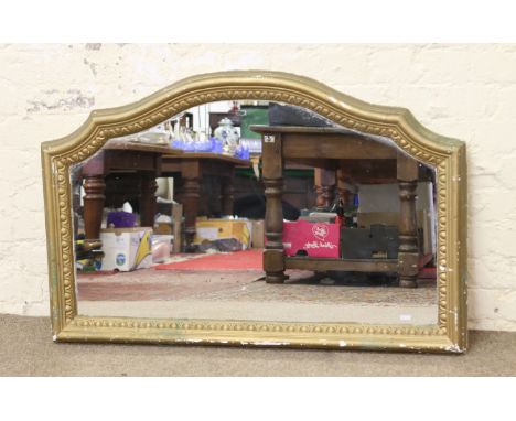 A decorative gilt framed wall mirror.