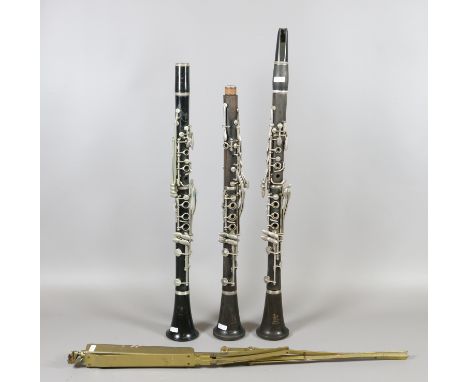 Two Boosey & Hawkes London 'Emperor' clarinets, an American manufactured clarinet made for Boosey & Hawkes and a brass sheet 