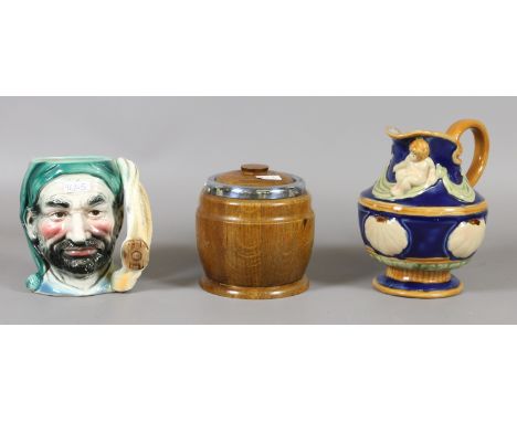 A Majolica style jug, a bed time character jug and an oak tea caddy.