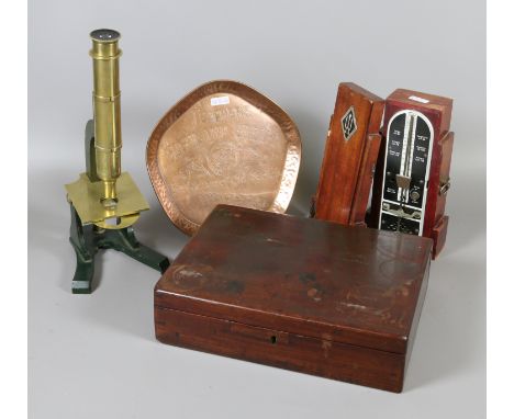 A brass microscope, cased metronome, copper advertising Teachers tray and a mahogany box. 