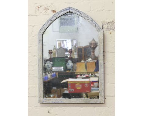 A framed arch top wall mirror.