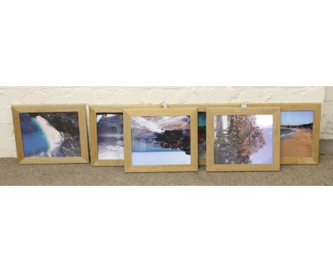 A set of six light oak picture frames.