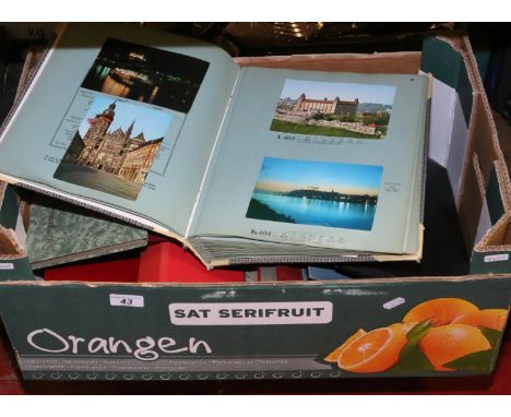 A box of assorted postcard albums and contents, along with photograph albums and contents.