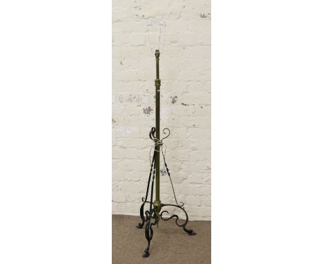 A brass rise and fall standard lamp.