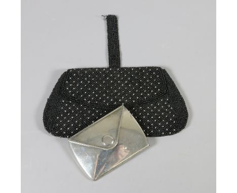 A French beadwork purse and a ladies envelope shaped mirror.