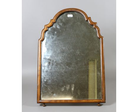 A mahogany framed arch top strut mirror. 