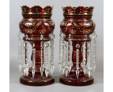 A pair of early C20th ruby glass lustres with gilt and enamel decoration. Condition Report. To be used as a guide only. Two v