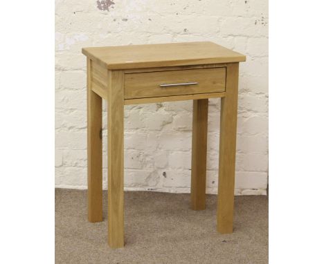 A good quality solid light oak side table with single drawer raised on square cut legs.