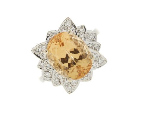 An 18ct gold orange topaz and brilliant-cut diamond cocktail ring, with slightly tapered shoulders, topaz estimated weight 6.