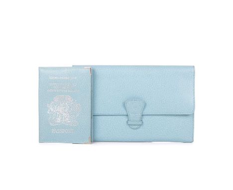 Aspinal of London, a travel wallet with matching passport cover, crafted from light blue grained leather, with front flap clo