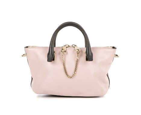 Chloe, a small bicolour Baylee handbag, featuring a navy blue and pale pink calfskin leather exterior, with polished gold-ton