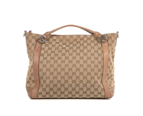 Gucci, a monogram handbag, designed with the maker's classic GG canvas exterior and brown leather trim, with silver-tone mono