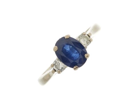 An 18ct gold oval-shape sapphire and brilliant-cut diamond three-stone ring, sapphire estimated weight 1.25ct, estimated tota