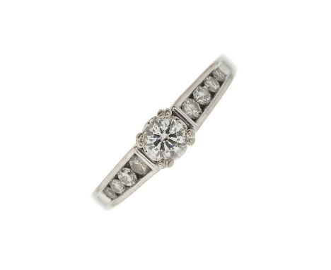 An 18ct gold brilliant-cut diamond single-stone ring, with similarly-cut diamond line shoulders, total diamond weight 0.50ct,