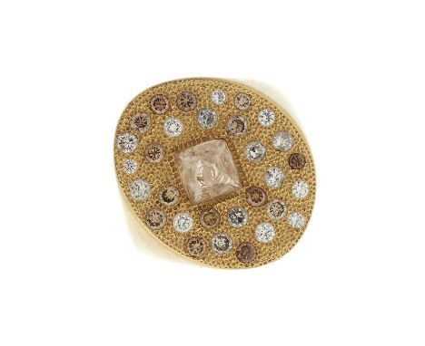 De Beers, an 18ct gold diamond and fancy coloured diamond Talisman dress ring, designed as a rough brown diamond, within a br