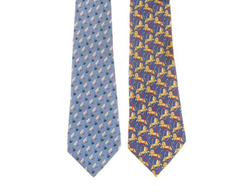 Hermes, two silk ties, to include a light blue tie featuring a frog motif, and a darker blue tie featuring lions jumping thro