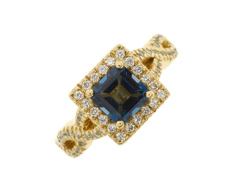 An 18ct gold blue topaz and brilliant-cut diamond cluster dress ring, with similarly-cut diamond woven shoulders, topaz estim