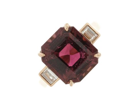 An 18ct gold purple tourmaline and diamond three-stone ring, tourmaline estimated weight 5ct, estimated total diamond weight 