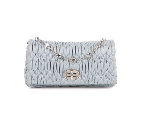 Miu Miu, a matelasse crystal leather handbag, featuring the maker's signature quilted blue leather exterior, with silver-tone