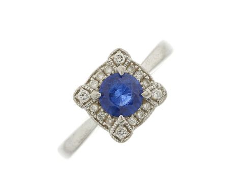 A platinum sapphire and brilliant-cut diamond cluster ring, sapphire estimated weight 0.50ct, estimated total diamond weight 