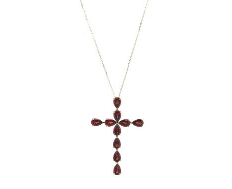 An 18ct gold pear-shape garnet cross pendant, suspended from an 18ct gold trace-link chain, total garnet weight 5ct, engraved