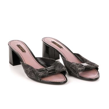 Louis Vuitton, a pair of unworn bow block heel sandals, designed with monogram patterned black denim uppers, featuring a fron