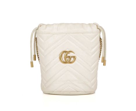 Gucci, a Mini Marmont bucket handbag, featuring a chevron quilted cream leather exterior with heart detail to the reverse, br