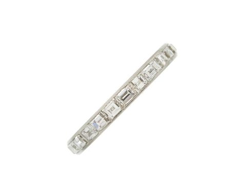 A mid 20th century platinum calibre-cut diamond full eternity ring, with engraved sides, estimated total diamond weight 1ct, 