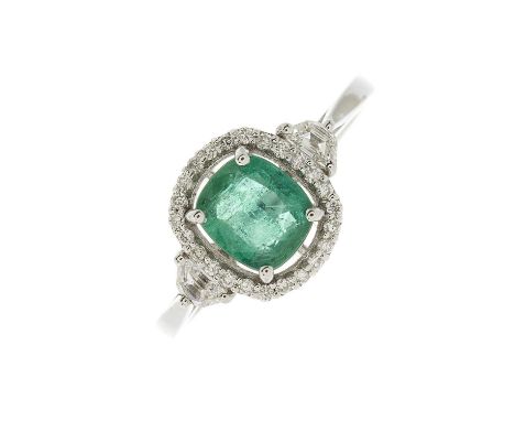 An 18ct gold emerald and brilliant-cut diamond cluster dress ring, with fancy-shape diamond sides and tapered shoulders, emer