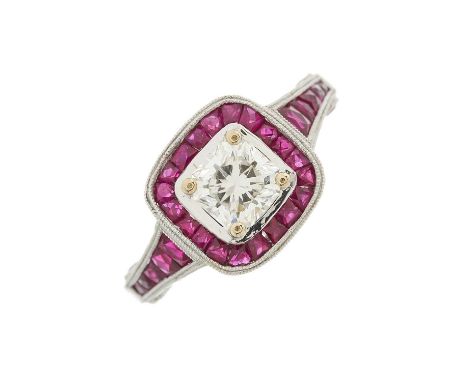 An 18ct gold Lucere-cut diamond single-stone dress ring, with calibre-cut ruby surround and shoulders, to the similarly-set g